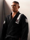 Bjjlifestyle black professional BJJ kimono with premium embroidery and reinforced collar, worn by practitioner.